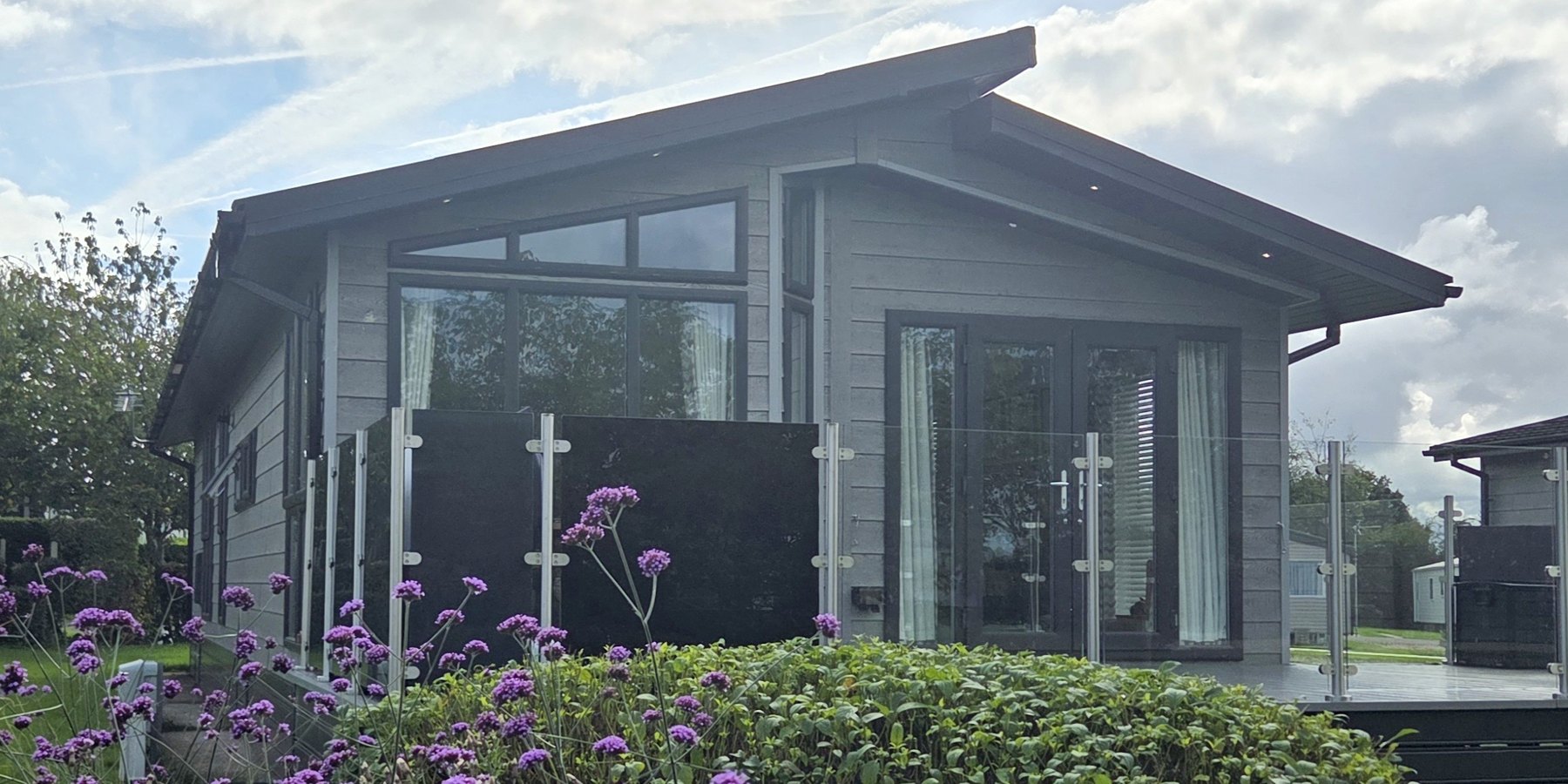 2021 Omar Alderney twin lodge with wraparound balcony at Pickmere Lake